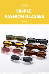 Close-up of assorted small cat-eye sunglasses in multiple colors showing detailed specs