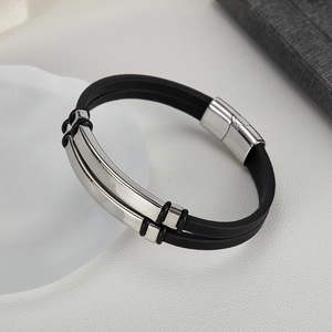 Detail of double-layer black leather bracelet with silver metal magnetic buckle and rubber rings