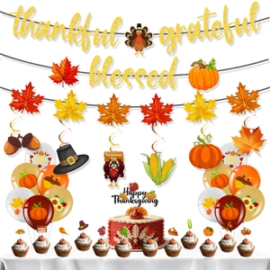 Detailed Thanksgiving party kit with gold glitter banners, festive balloons and cake toppers