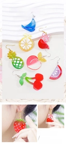 Macro detail of resin earrings made with DIY starfish shell and fruit silicone molds