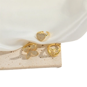 Three gold flower zircon adjustable rings set with heart and clover designs for women