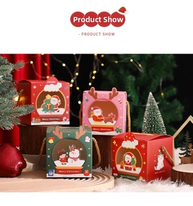 Close-up of festive Christmas gift boxes with cartoon patterns and round window detail