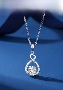 Close-up of S925 silver infinity heart pendant with a large moissanite center stone