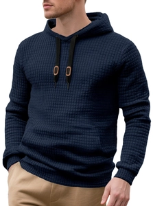 Detail view of navy blue waffle knit texture and leather accents on hooded sweatshirt