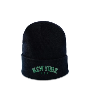 Detail of New York USA embroidery on a black ribbed knit beanie with street style