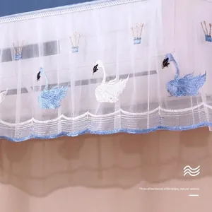 White lace air conditioner dust cover featuring embroidered blue swans and lace borders