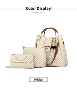 Three-piece tote bag set with yellow geometric patterns and brown leather straps
