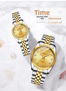 Close-up of luxury gold and silver quartz watches with crystal markers and seashells