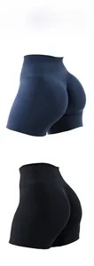Detail of high-waisted seamless fitness shorts in navy and black with lift-up texture