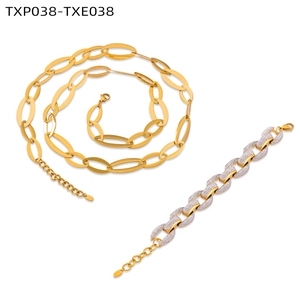 Detailed shot of gold-plated interlocking chain necklace and cubic zirconia bracelet set
