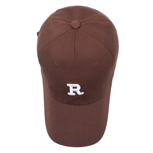 Brown cotton baseball cap with white R embroidery and a curved brim on a white background