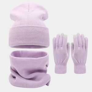 Close-up of lavender knitted winter set with touch-screen gloves and loop scarf