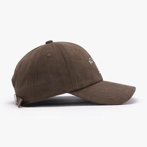 Classic dark brown cotton canvas baseball cap with white embroidered letters in side view