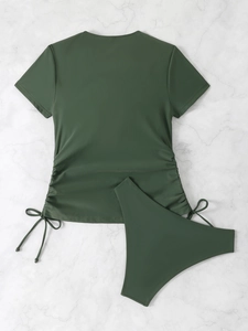 Detail of dark green two-piece tankini set with side drawstring and short sleeves