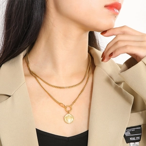 Vintage 18k gold plated double layer necklace with a round crown pendant on model