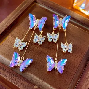 Elegant gold butterfly tassel earrings with purple gradient crystals and zircon accents