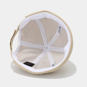 Classic beige cotton docker hat showing internal stitching and fabric label