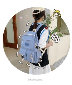 Outdoor shot of light blue water-resistant nylon backpack with multiple utility pockets