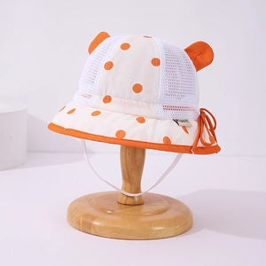 Detail of baby sun hat with breathable mesh, orange polka dots and cute 3D ears