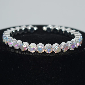 Detail of silver plated open bracelet with a row of sparkling rainbow AB crystals