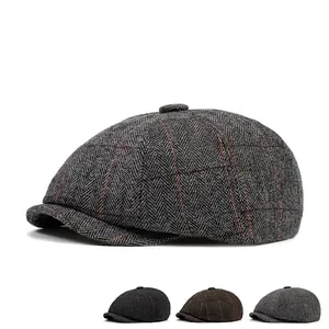 Men's herringbone newsboy cap in grey and brown variants with classic textured wool fabric