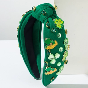 Detail of green St. Patrick's Day headband with rhinestones, shamrocks and lucky hat