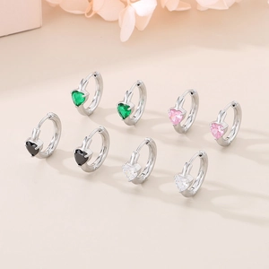 Polished silver heart hoop earrings with green, pink, black, and white crystal stones
