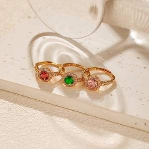Detail of 18K gold plated rings with colorful zircon halo stones and adjustable band