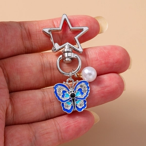 Blue enamel butterfly keychain with rhinestones and pearl charm on a silver star clasp