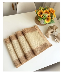 Close-up of rectangle woven paper placemat with gradient color and tassel fringe