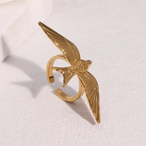 Golden stainless steel swallow bird open ring with detailed feather texture in a 45-degree view