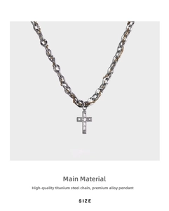 Detail of titanium steel cross necklace with layered chains and square-cut cubic zirconia