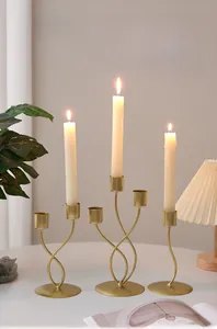 Set of three Nordic gold iron candle holders in different heights for home table decor