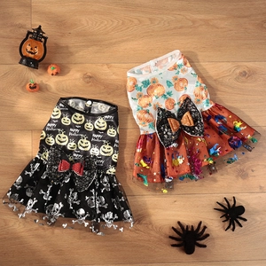Detail of Halloween pet dress with orange sequin tulle and festive pumpkin prints