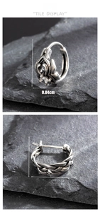 Detailed view of vintage gothic stainless steel earrings with zircon and braided textures