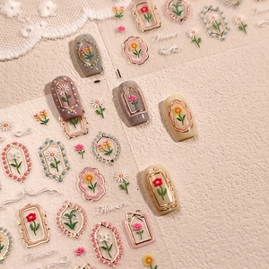 Retro floral nail stickers with gold embossed borders and vintage rose designs