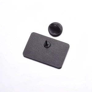 Black rectangular enamel pin back with metal needle and black rubber clutch secure butterfly clasp