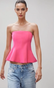 Detail view of pink strapless peplum top with waist cinching and flare hem for women