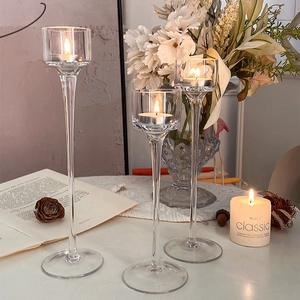 Three-piece set of elegant glass candle holders for romantic dinner and wedding decor