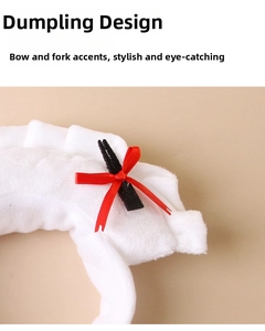 Detailed view of the soft white plush dumpling headband with a cute red bow decoration