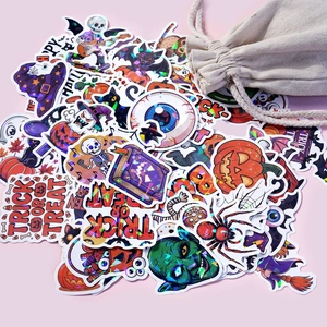 Macro shot of laser holographic Halloween stickers spilling from a linen gift bag
