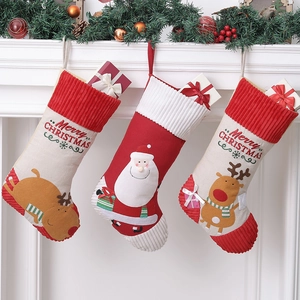 Three-piece Christmas stockings set with Santa and reindeer applique on fireplace