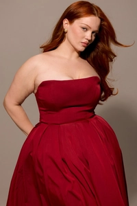 Detail of elegant wine red strapless dress featuring premium satin and draped pleats
