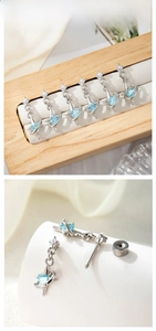 Detail of star-themed heart blue zircon earring with flat back screw fastening