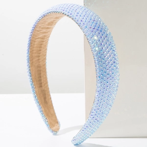 Detailed view of padded light blue headband with iridescent rhinestones and velvet lining