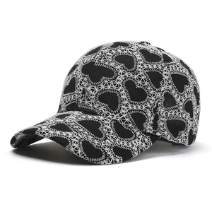 Black baseball cap with white heart lace embroidery and classic curved brim design