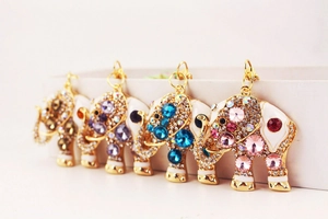 Detailed view of rhinestone-encrusted elephant keychains in diverse enamel colors