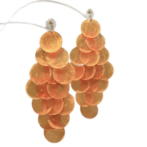 Vibrant orange shell tassel earrings with layered round discs for beach vacation style