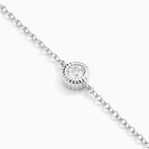 Detailed macro view of an S925 silver bracelet with a brilliant round-cut zirconia gem