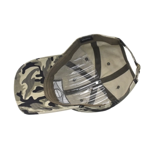 Detail view of cotton camo baseball cap interior stitching and material label